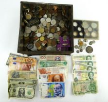 A large quantity of British, European & world coins and some banknotes including US dollars & Euros.