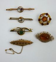 Six antique gem set 9ct gold brooches including diamonds, garnets, amber, citrine and seed pearls