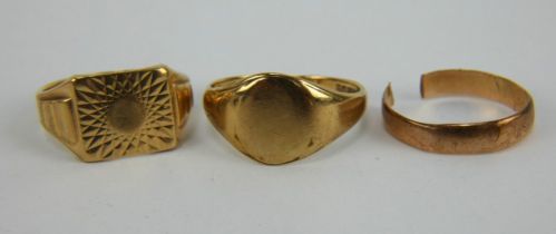 Two 9ct gold signet rings and a 9ct gold wedding band (cut). Combined gross weight 10.2 grams