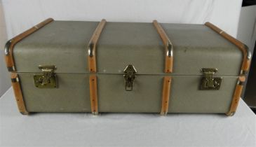 A vintage wooden bound travelling trunk