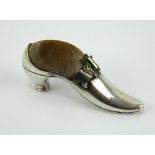 An Edwardian silver shoe shaped pincushion, hallmarked Birmingham 1903, Adie & Lovekin. Length 6.5cm