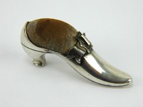 An Edwardian silver shoe shaped pincushion, hallmarked Birmingham 1903, Adie & Lovekin. Length 6.5cm