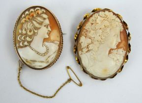 Two large antique finely carved cameo brooches in yellow metal settings, one marked 9ct. Largest 5.5