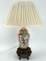 A Chinese porcelain baluster form lamp finely decorated in the famille rose style
