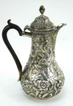 Victorian silver coffee pot/hot water jug ornately decorated. London 1897, Goldsmiths & Silversmiths