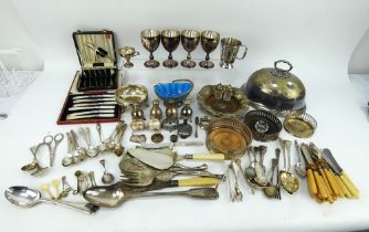 A mixed lot of silver plated table wares including cutlery, goblets, wine coasters, cruets, etc.