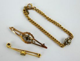 An antique yellow metal bar brooch, a 9ct gold bar brooch and a seed pearl set chain link bracelet.