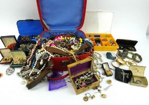 A large quantity of vintage costume jewellery, beads, brooches, badges, bangles etc