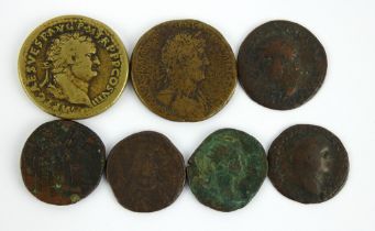 Seven mixed Roman coins including Vespasian. Largest 33mm diameter.