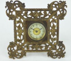 Late 19th century French clock in ornate cast brass surround