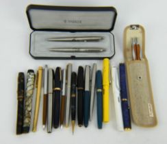 Two 1930s marbled fountain pens, a Waterman 515, a Parker Duofold, a gold plated Sheaffer pen etc