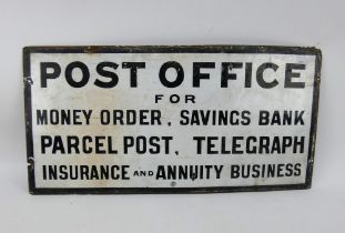 A period Post Office sign in black and white enamel. Age related rust and wear. 66cm x 33cm.