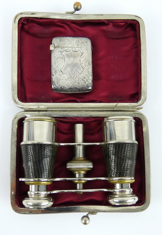 A late 19th century silver vesta case, 1896, and a cased pair of leather bound opera glasses
