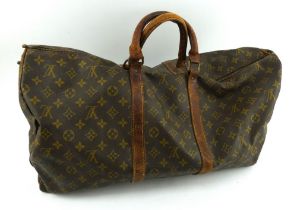 A vintage Louis Vuitton leather and canvas travel holdall. 51cm x 30cm.