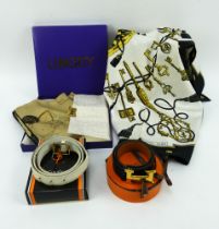 A Hermes silk scarf, a boxed Liberty silk scarf, a boxed Hermes leather belt & a YSL leather belt.