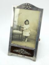 A late Victorian silver picture frame with tortoiseshell panel, hallmarked London 1900. Leather back