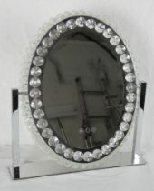 A contemporary chrome and cut crystal illuminated dressing table mirror. 52cm x 46cm.