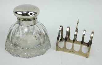 A cut glass silver topped inkwell and a silver toast rack, Both fully hallmarked. Toast rack 55 gram