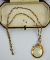 A 9ct gold Edwardian locket pendant on a 9ct marked fancy link chain. Diameter 2.2cm.