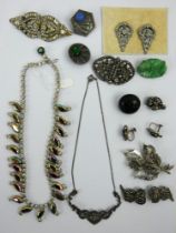 A collection of vintage marcasite and paste brooches, necklaces and earrings, including some silver.