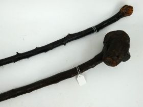 A vintage Irish shillelagh with carved shamrock and an similar Irish blackthorn walking stick.