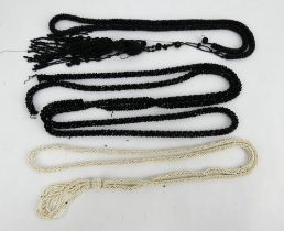 Two black beaded tassel end belts