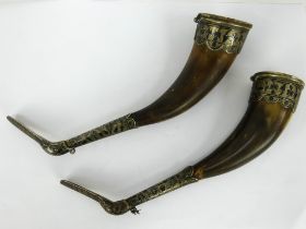 A pair of Caucasian horn drinking cups with niello decorated white metal mounts. Length 22cm.