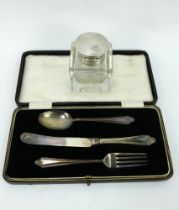 A silver mounted inkwell, Birmingham 1922, & a boxed 3 piece silver christening set, Birmingham 1929