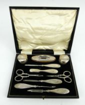 A George V cased silver vanity set