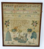 A Georgian needlework sampler with central figure of a stag with hawks, trees and flower posies.