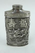 An antique Chinese white metal talc flask with ornate dragon and Chinese character design. Marked HC