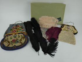 Three vintage tapestry handbags, a diamante evening bag and a box of various fashion feathersl