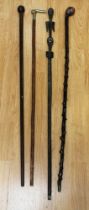 Collection of early to mid 20th century walking sticks  i.e. African carved whistle stick and knob