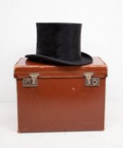 A late 1930s leather small square container hat box, contains a Gerrard top hat by Austin Reed of