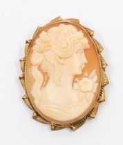 A vintage 9ct gold mounted cameo brooch, comprising a shell carved cameo depicting a female bust,