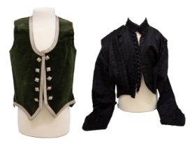 A child's velvet Scottish highland dress waistcoat in bottle green with silver buttons and braiding,