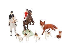 Beswick - A hunts group to include, huntsman upon rearing horse, a hunts lady on a dapple grey