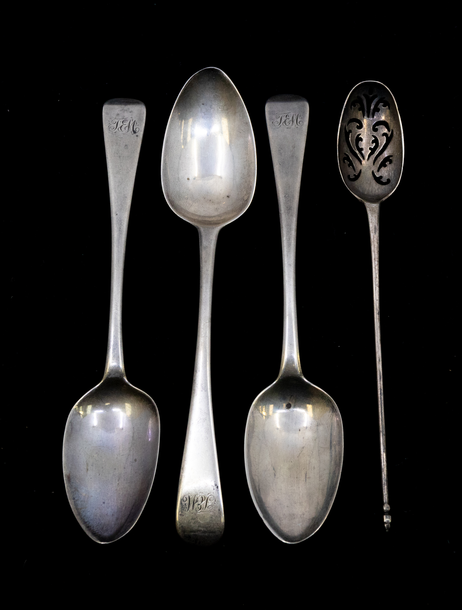 A George II silver mote spoon with pierced bowl and thin long stem and terminal, hallmarked by