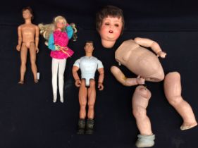 An early 20th century Armand Marseille doll, rosy cheeks (in parts), along with three Action Man/