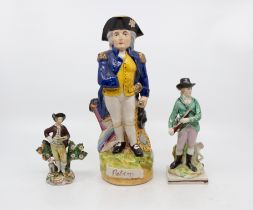 Two early 19th century Staffordshire pearl ware figures i.e. gamekeeper/hunter and traveler. Along