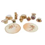 A collection of early 20th century Royal Worcester blush ivory plates, cups, saucers, vases and
