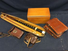 A collection of assorted photographs in wooden box together with two cameras in leather cases,