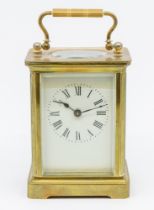 Early to mid 20th century French brass carriage clock, bevel glazed panels, roman numerals.