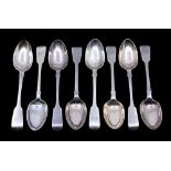 A matched collection of eight late William IV or Victorian fiddle patterned dessert spoons, all