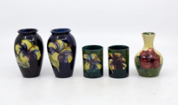 Moorcroft - A collection of early to mid 20th century pieces to include; a pair of small cylindrical