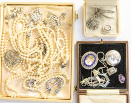 A collection of vintage costume jewellery to include an enamel silver set bracelet, floral design, a