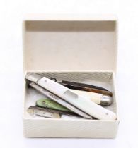 A collection of six 20th century miniature or novelty pocket knives to include; a Sheffield silver