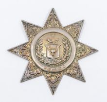 A Victorian silver Ancient Order of Foresters sash badge, having foliage and wreath relief design