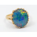 An opal triplet and 9ct gold ring, comprising an oval stone approx 12 x 14mm, claw set, size N,