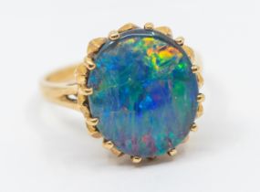 An opal triplet and 9ct gold ring, comprising an oval stone approx 12 x 14mm, claw set, size N,